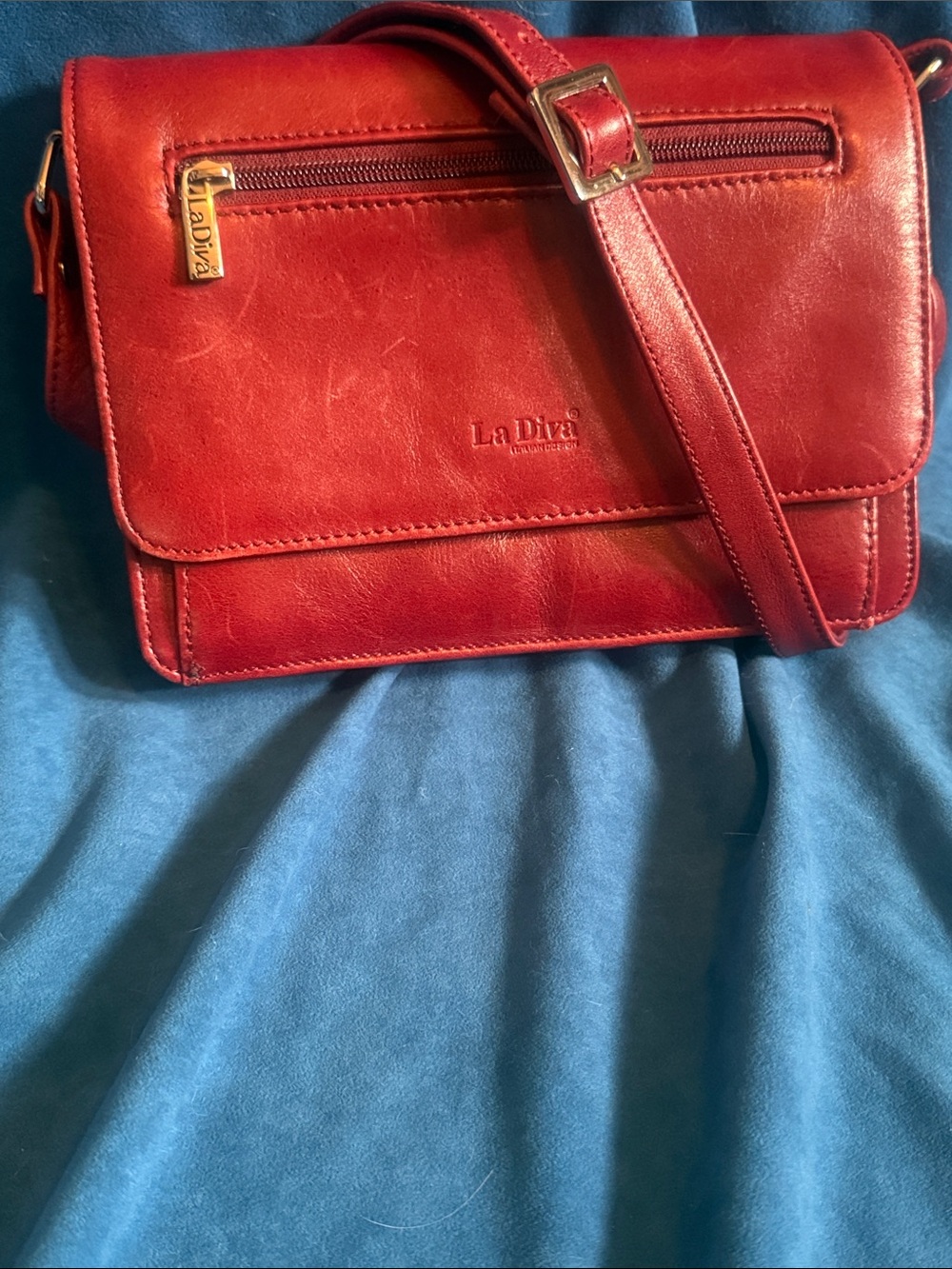 La Diva Italian design Red Leather Crossbody Bag, like new. Long strap